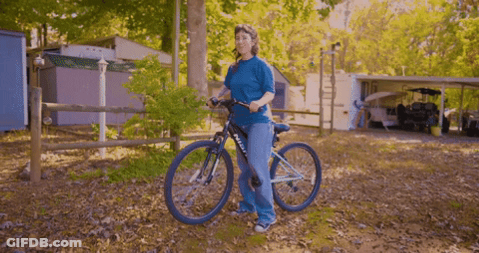 Woman Riding Cycle GIF