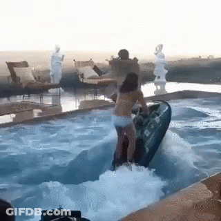 Woman Riding Jet Ski Into Pool GIF