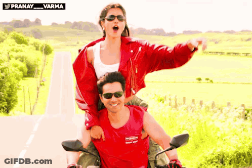 Woman Riding On Back Of Man On Motorcycle GIF