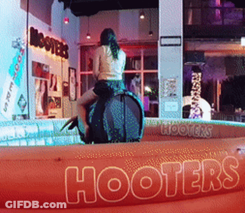 Woman Riding Rodeo Bull At Hooters Sign GIF