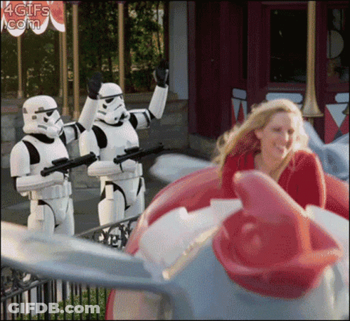Woman Riding Roller Coaster Behind Stormtroopers GIF