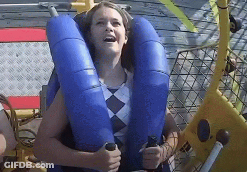 Woman Riding Roller Coaster In Blue Life Preserver GIF