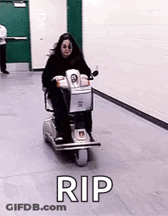 Woman Riding Scooter With Rip GIF