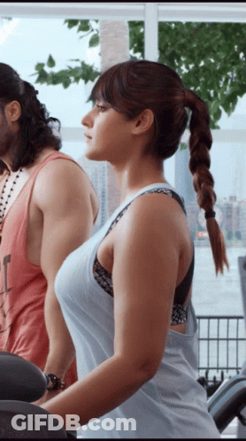 Woman Riding Treadmill With Braided Ponytail GIF