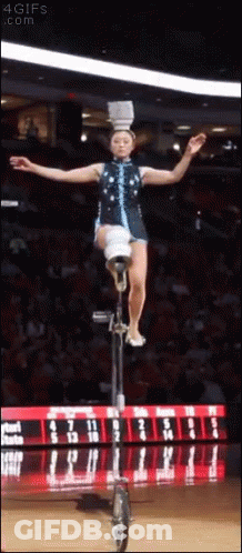 Woman Riding Unicycle With Bucket On Head GIF
