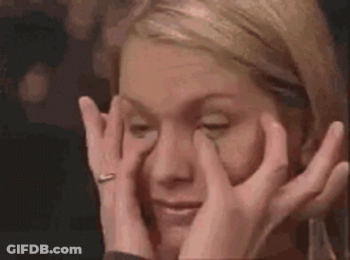 Woman Rubbing Eyes With Ring GIF