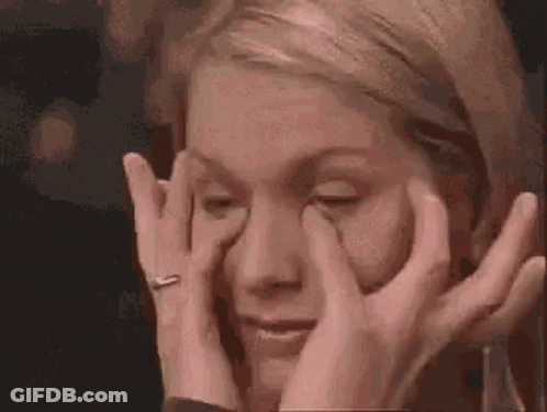 Woman Rubbing Eyes With Wedding Ring GIF