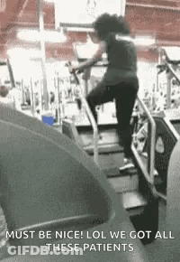 Woman Running On Treadmill Wearing Mask GIF