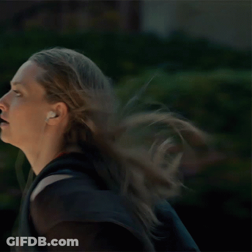 Woman Running With Headphones And Backpack GIF