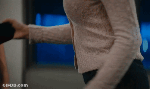 Woman's Arm Held By Man GIF