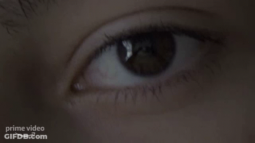 Woman's Eye With Arrow Pointing To Prime Video Logo GIF