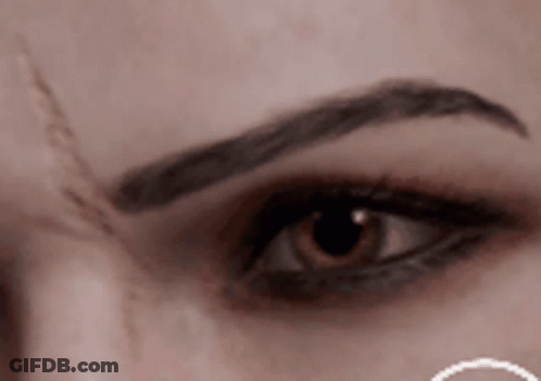 Woman's Eye With Eyebrow Tattoo GIF