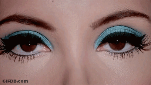Woman's Eyes With Blue And Black Eye Shadow GIF