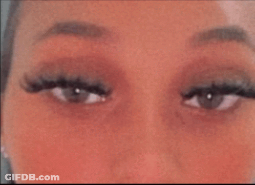 Woman's Eyes With Long Eyelashes And Red Cheeks GIF