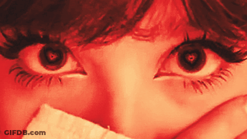 Woman's Eyes With Paper Over Mouth GIF