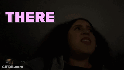 Woman's Face Behind Someone Text GIF