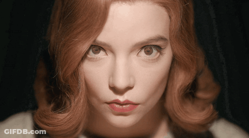 Woman's Face Close-Up Dark Background GIF