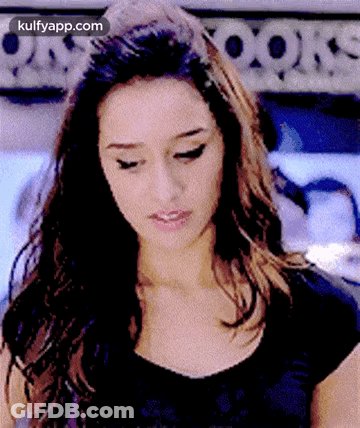 Woman's Face Close-Up In Black Shirt GIF