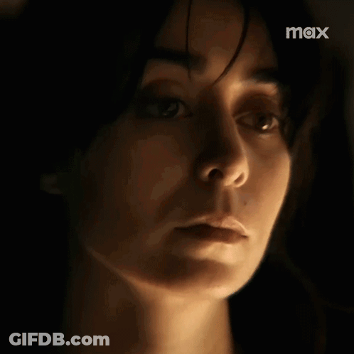 Woman's Face Close Up In Dark GIF