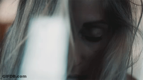 Woman's Face Close Up With Light Behind GIF
