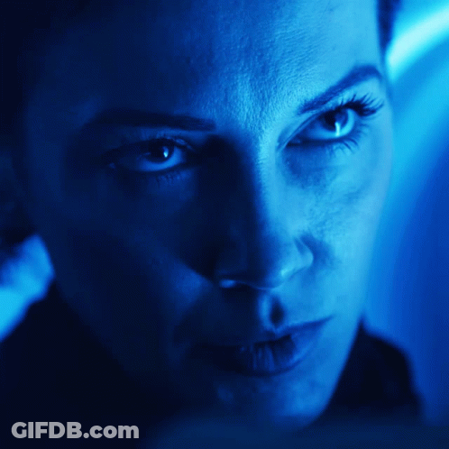 Woman's Face In Blue Light GIF