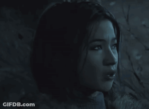 Woman's Face In Dark Room GIF