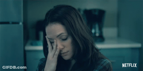 Woman's Face In Dark Room GIF