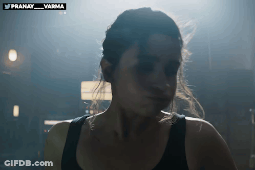 Woman's Face In Dark Room With Pranay Varma Watermark GIF