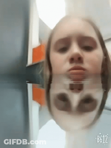 Woman's Face In Mirror With B612 GIF