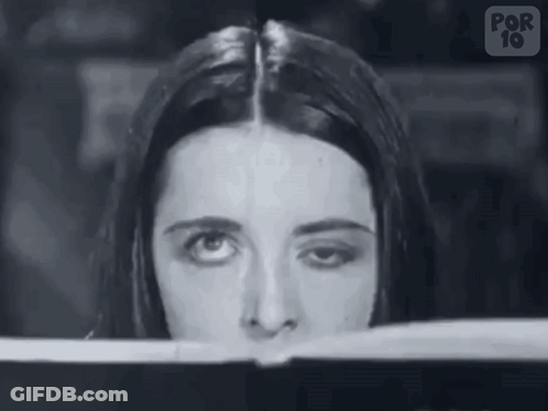 Woman's Face Looking Out Window Black And White GIF