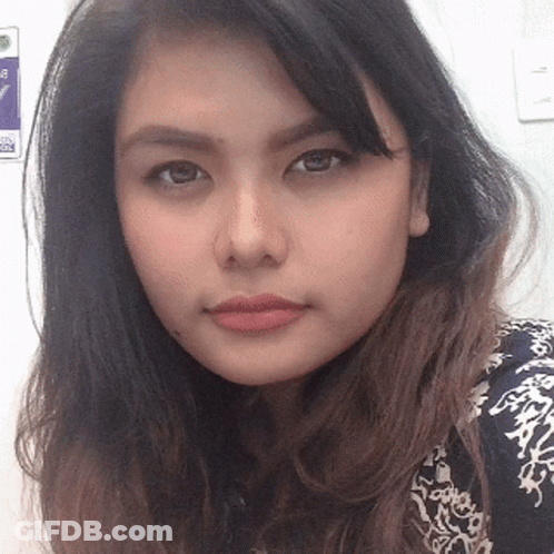 Woman's Face Near No Smoking Sign GIF