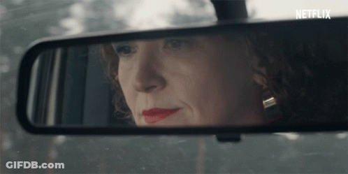 Woman's Face Reflected In Rear View Mirror Netflix GIF