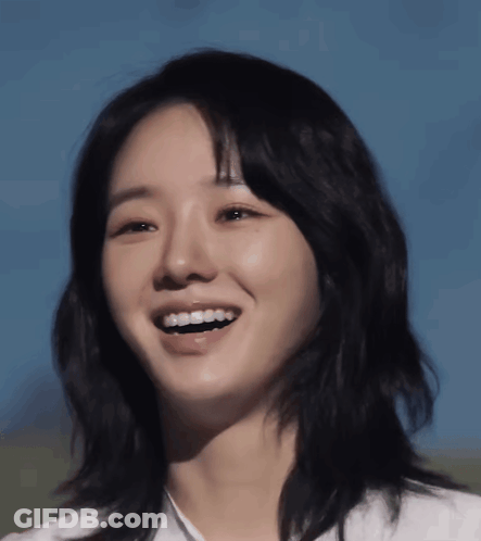 Woman's Face With Blue Sky Behind Her GIF