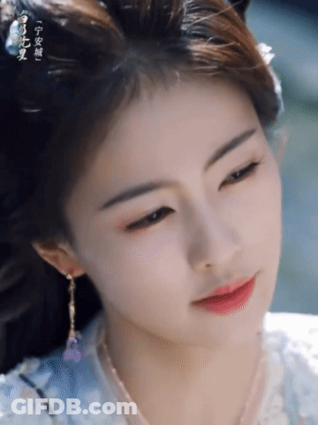 Woman's Face With Chinese Writing GIF