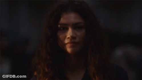 Woman's Face With Crowd Background GIF