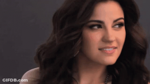 Woman's Face With Dark Hair Close Up GIF