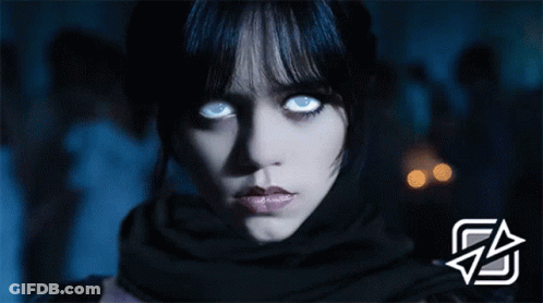 Woman's Face With Glowing Blue Eyes GIF