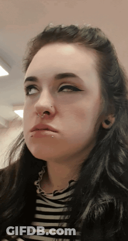 Woman's Face With Nose Ring And Piercings GIF