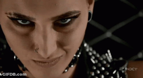 Woman's Face With NXT Text GIF