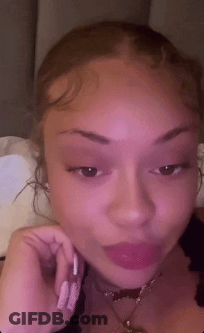 Woman's Face With Pink Background GIF