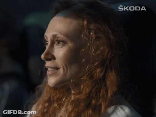 Woman's Face With Skoda Behind GIF