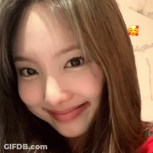 Woman's Face With Smiley Face GIF