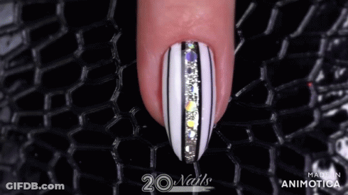 Woman's Finger With Black And White Striped Nails GIF