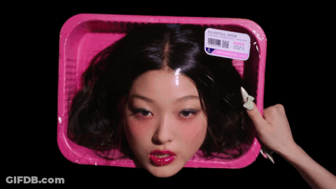 Woman's Head In Pink Container GIF