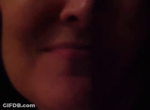 Woman's Lips In The Dark GIF