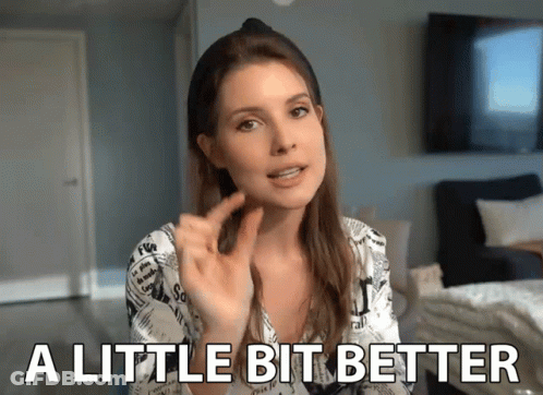 Woman Saying A Little Bit Better With Peace Sign GIF