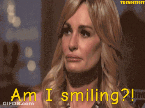 Woman Saying Am I Smiling Pixelated GIF