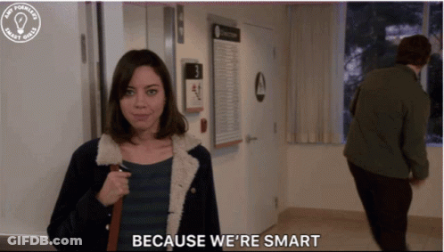 Woman Saying Because We're Smart With Man Behind GIF