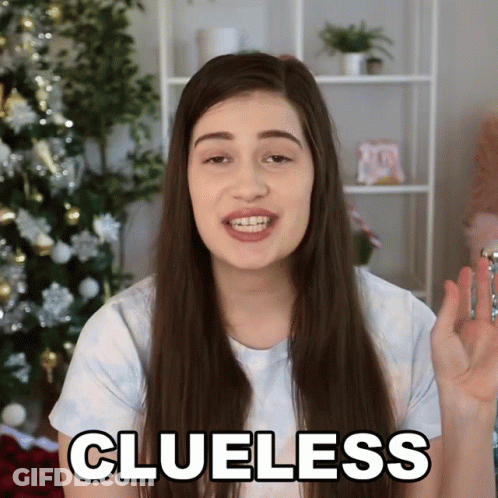 Woman Saying Clueless Holding Key Christmas Tree GIF
