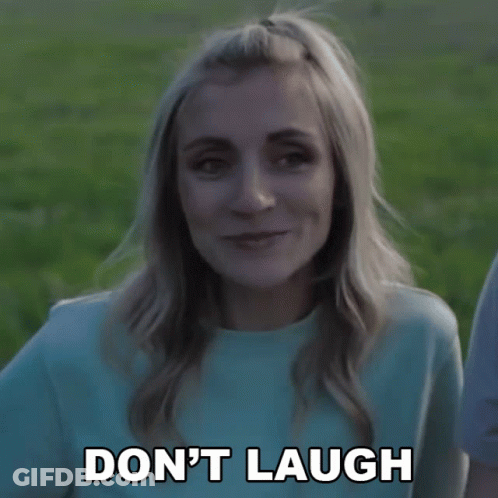 Woman Saying Don't Laugh In Blue Shirt GIF